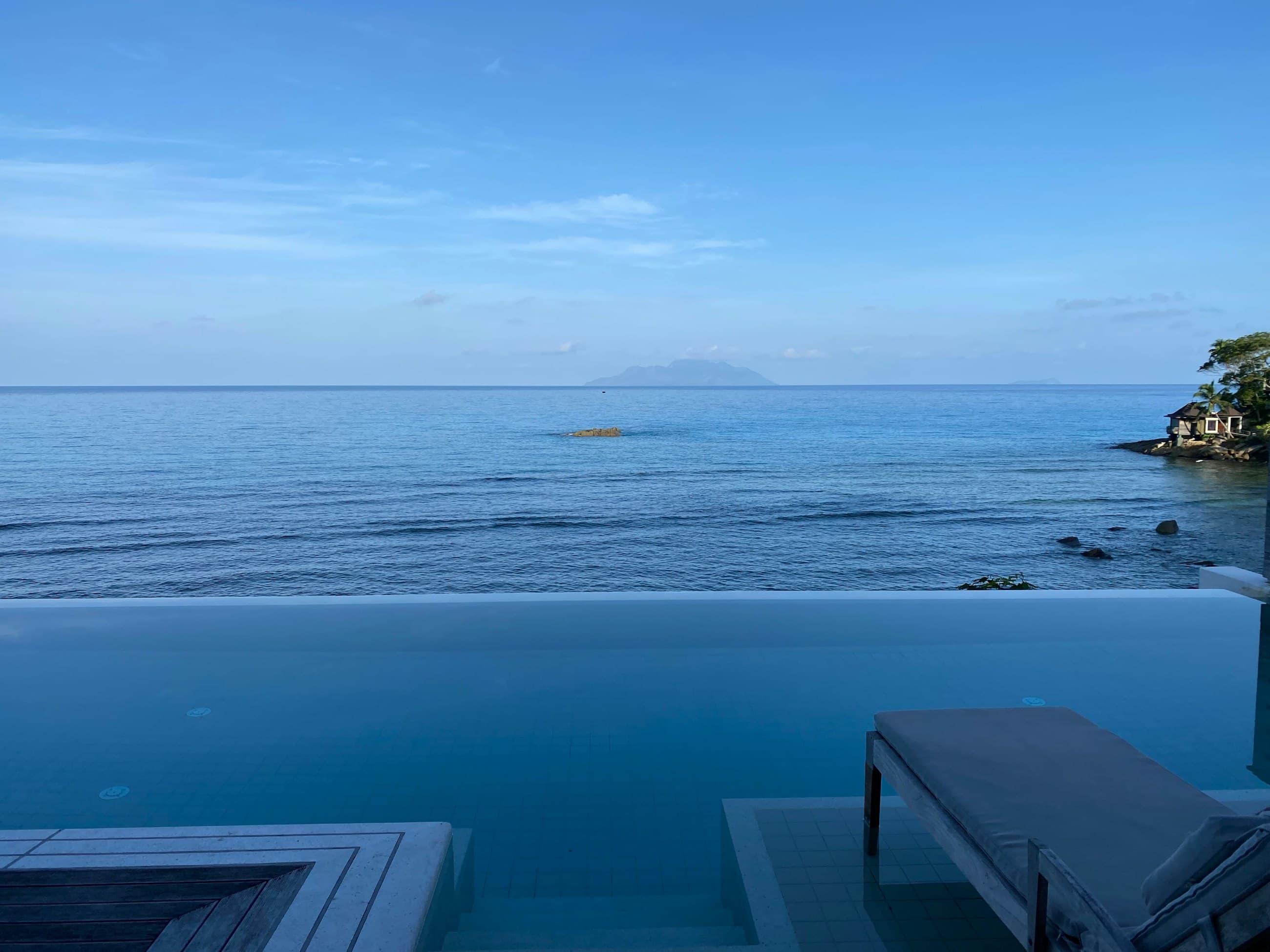 White villas above a deep blue Aegean bay