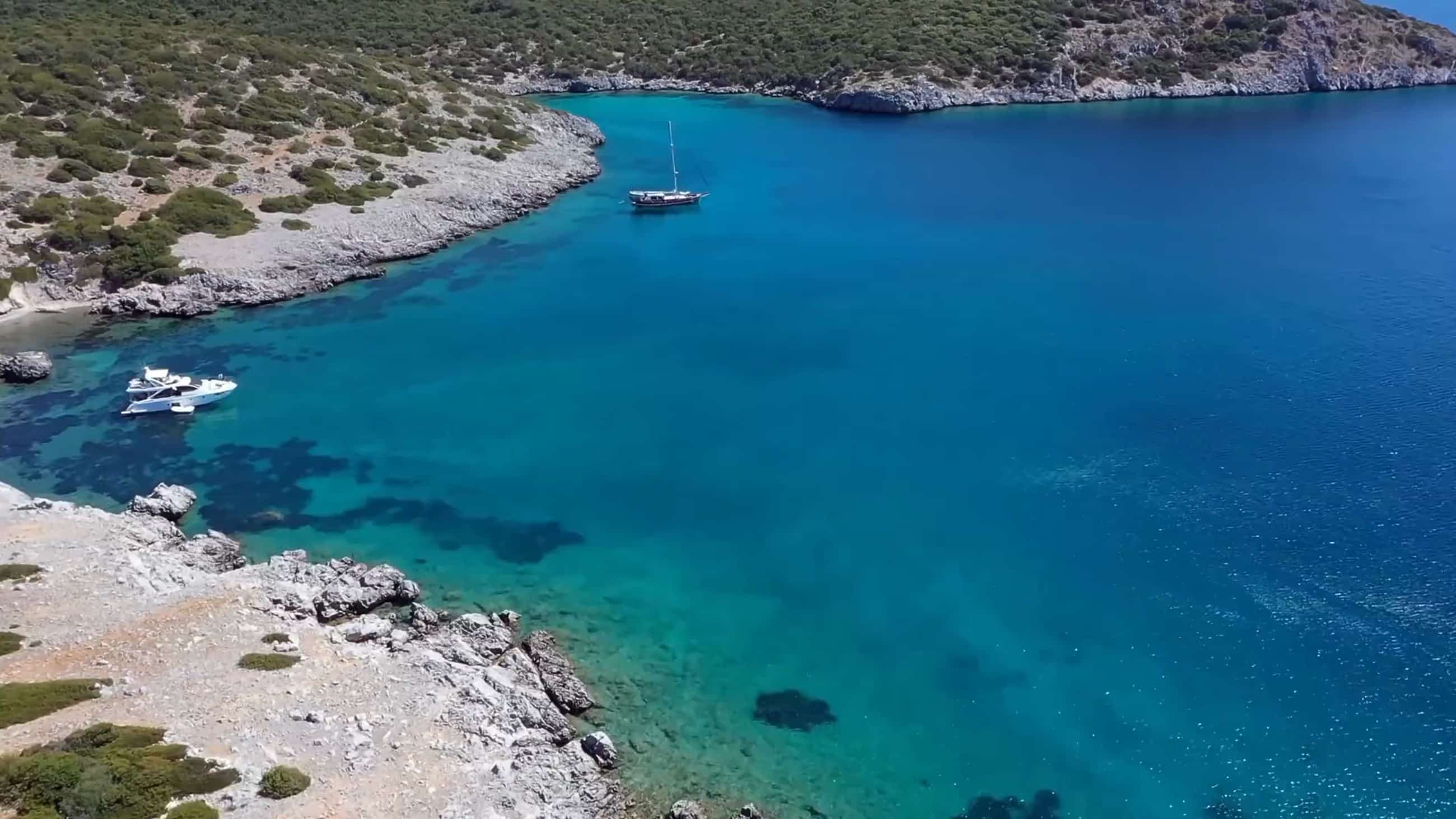 The bay of Bodrum with white houses and boats on deep blue water